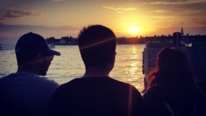 The children, watching the sunset, at Mallory Square, Key West.